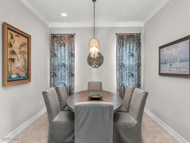 dining space with crown molding