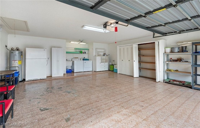 garage featuring ceiling fan, electric water heater, independent washer and dryer, and white fridge