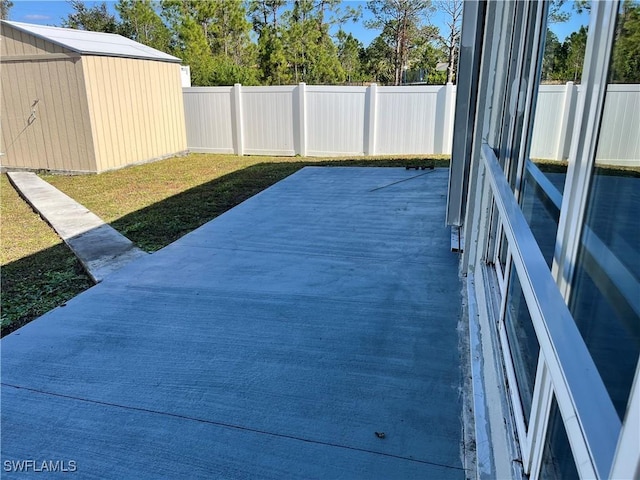 view of patio with a shed