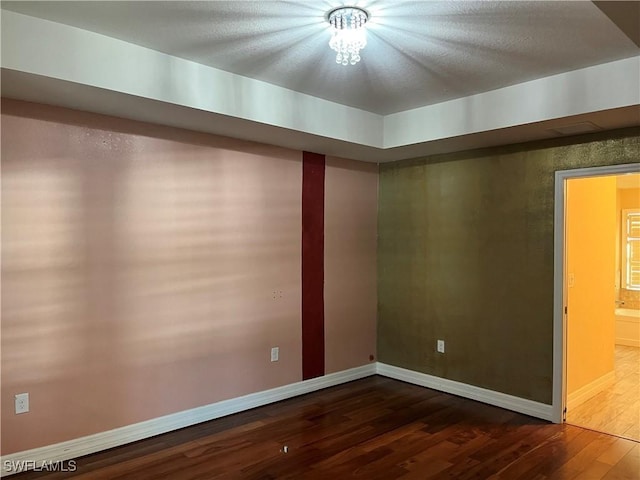 empty room featuring dark hardwood / wood-style floors