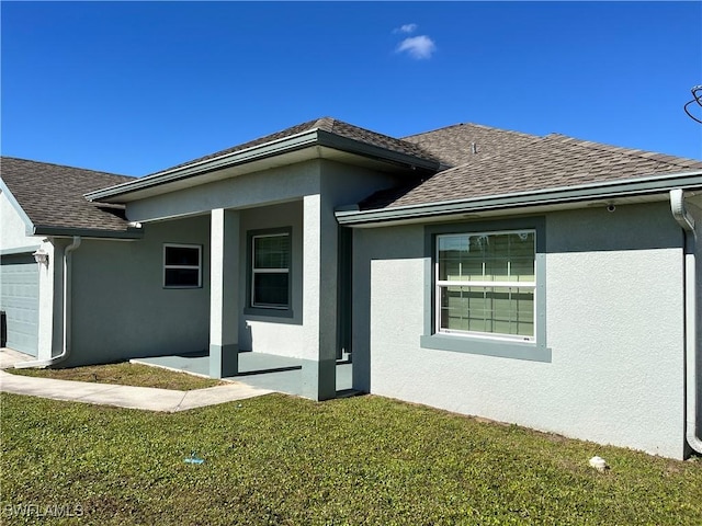 view of side of home featuring a lawn