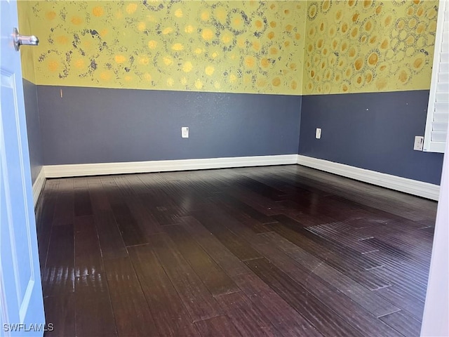 spare room featuring hardwood / wood-style flooring