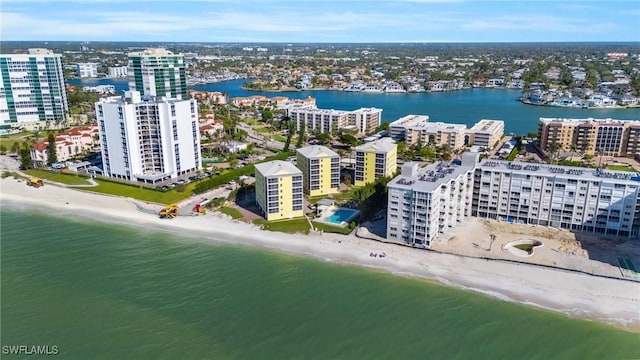 birds eye view of property featuring a view of the beach and a water view