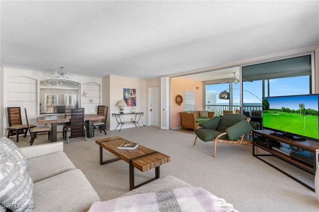 living room with a textured ceiling, ceiling fan, built in features, and light colored carpet