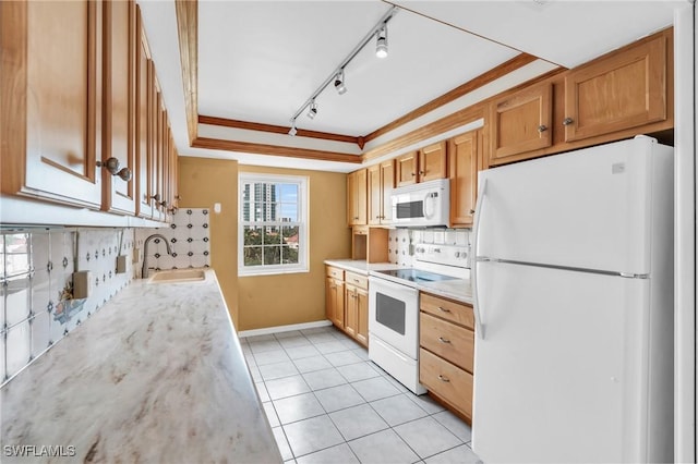 kitchen featuring sink, white appliances, ornamental molding, light tile patterned floors, and rail lighting