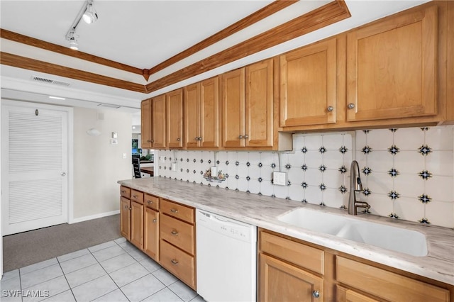 kitchen featuring sink, dishwasher, light tile patterned flooring, ornamental molding, and decorative backsplash