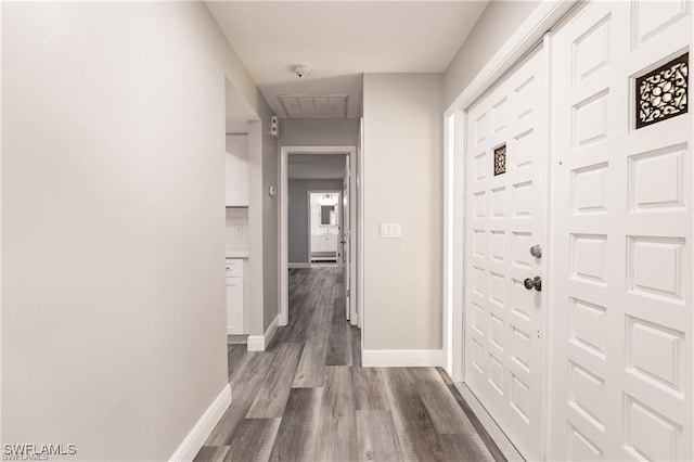 corridor with light hardwood / wood-style flooring