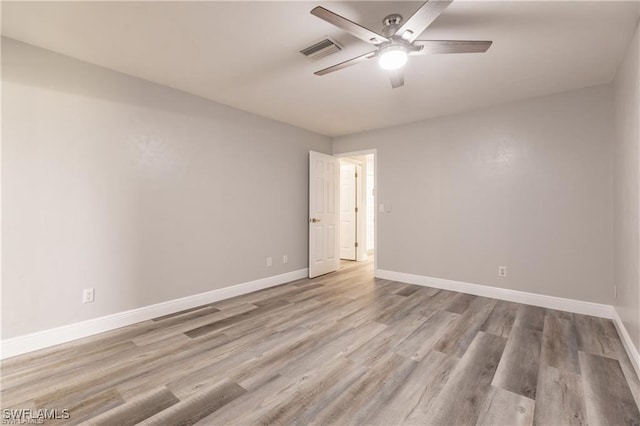 unfurnished room featuring light wood-type flooring and ceiling fan