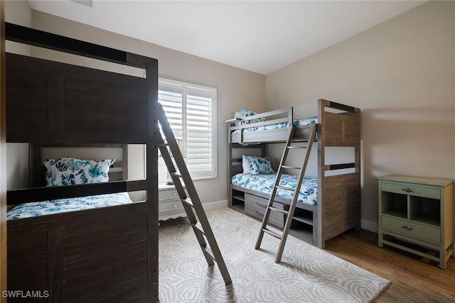 bedroom with hardwood / wood-style flooring