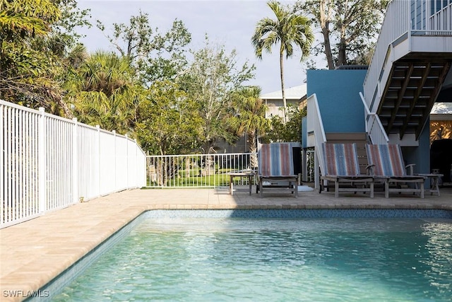 view of swimming pool with a patio