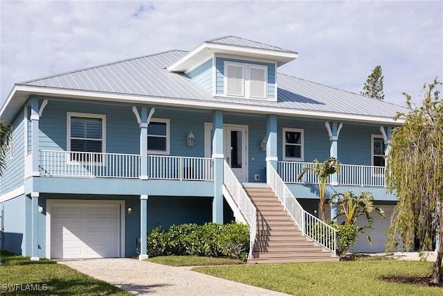 view of front of house featuring covered porch and a garage