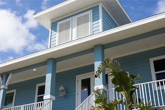 view of property exterior with a porch