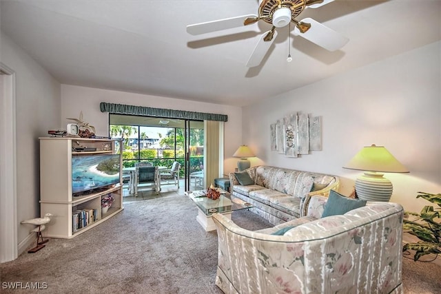 carpeted living room featuring ceiling fan