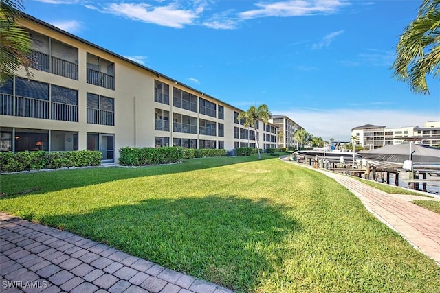 view of property's community featuring a yard