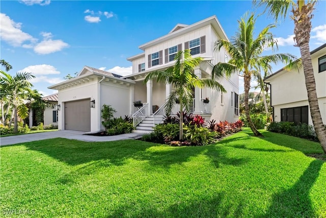 view of front of home featuring a front lawn and a garage