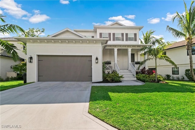 view of front of home with covered porch, a front lawn, and a garage