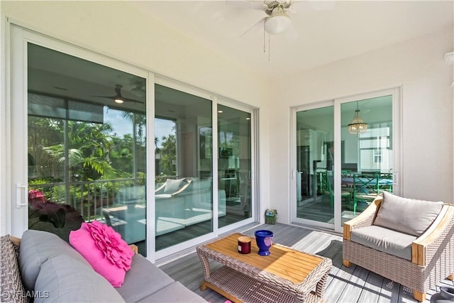 exterior space featuring ceiling fan and an outdoor hangout area