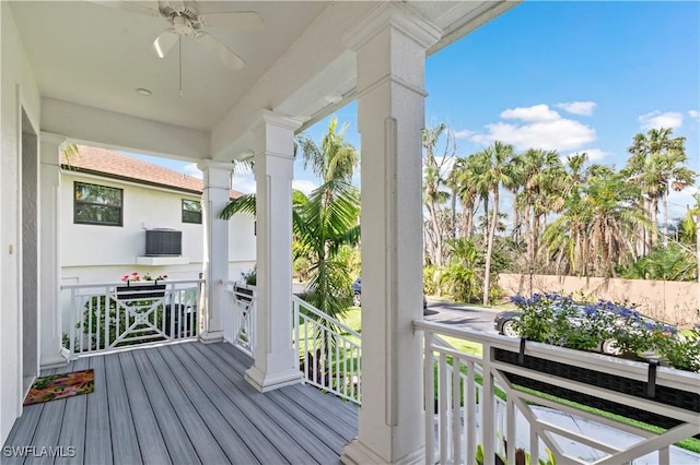 wooden deck featuring ceiling fan