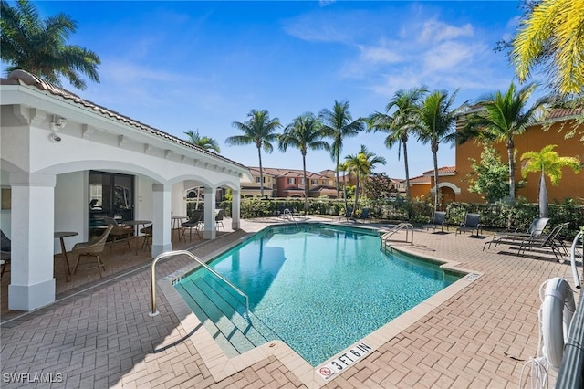 pool featuring a patio area