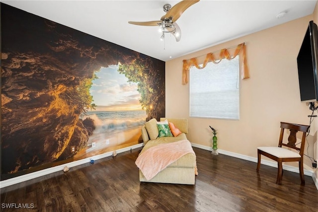 living area featuring dark wood-style flooring, a ceiling fan, and baseboards