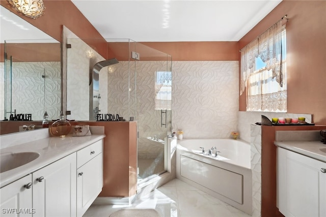 full bathroom with a stall shower, vanity, and a bath