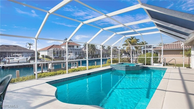 view of swimming pool with a patio, glass enclosure, an in ground hot tub, and a water view