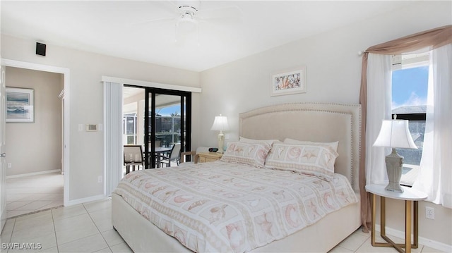 tiled bedroom with ceiling fan and access to exterior