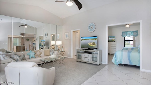 living room with lofted ceiling, light colored carpet, and ceiling fan