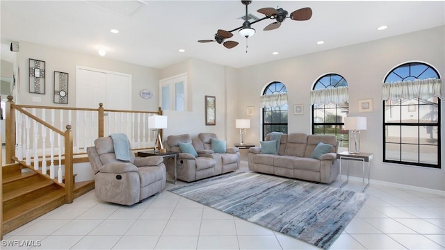 tiled living room with ceiling fan