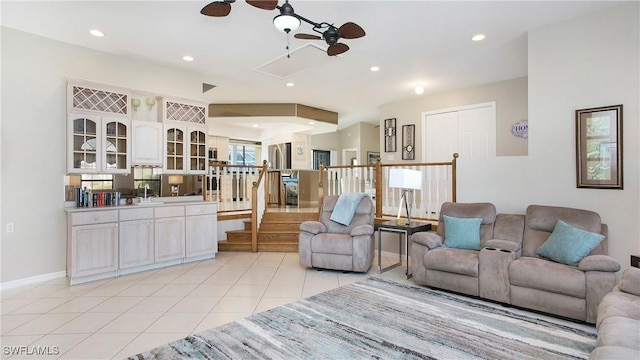 living room with ceiling fan and light tile patterned floors