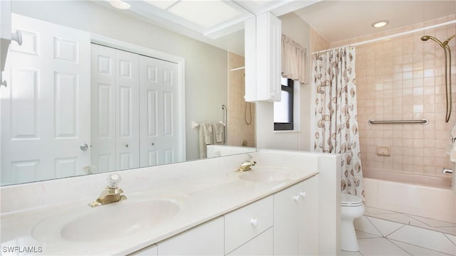 full bathroom featuring toilet, vanity, tile patterned floors, and shower / tub combo with curtain