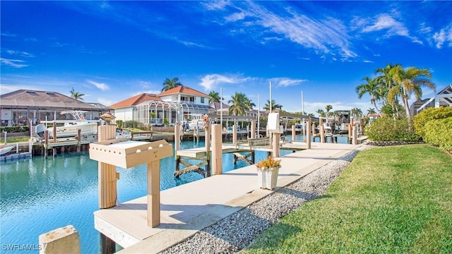 view of swimming pool featuring a yard, a dock, and a water view