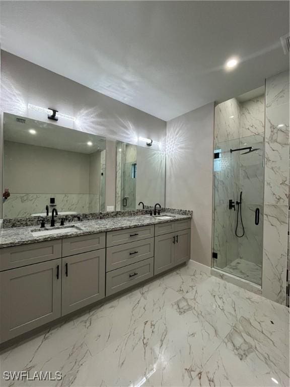 bathroom featuring vanity and a shower with shower door