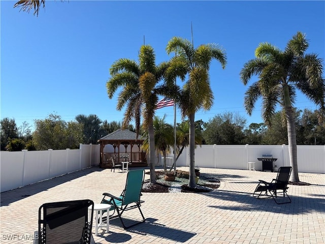 view of patio / terrace with grilling area and a gazebo