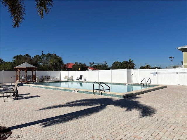 view of pool with a patio and a gazebo