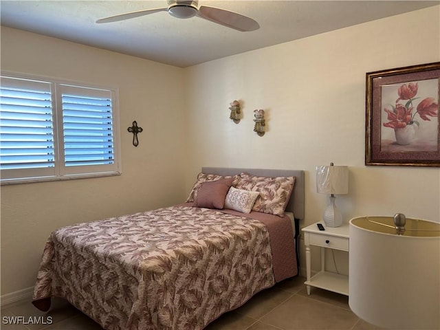 tiled bedroom with ceiling fan