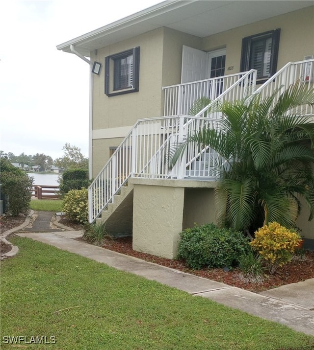 view of property exterior featuring a lawn