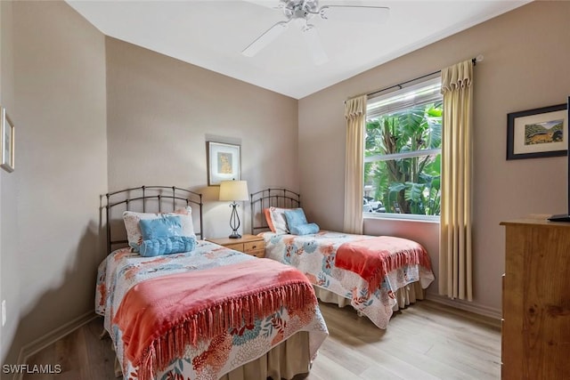 bedroom featuring light wood-type flooring and ceiling fan