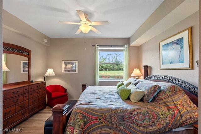 bedroom with ceiling fan and light hardwood / wood-style floors