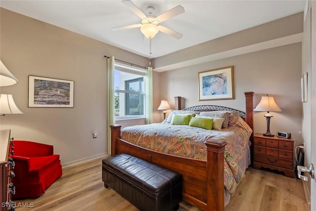 bedroom with ceiling fan and light hardwood / wood-style flooring