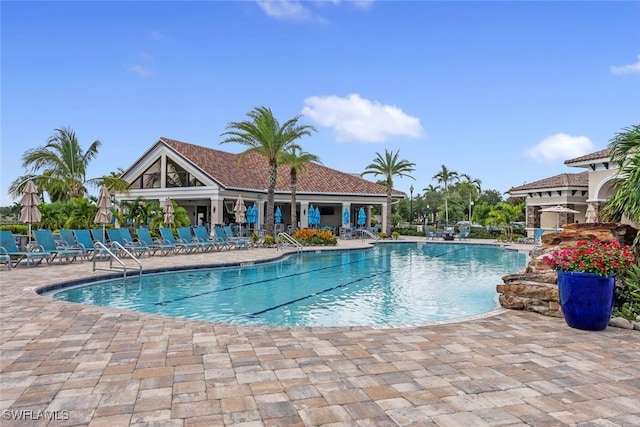 view of swimming pool with a patio area