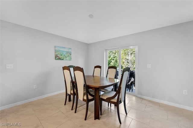 dining space with light tile patterned flooring