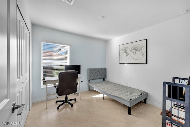 office space with light tile patterned floors