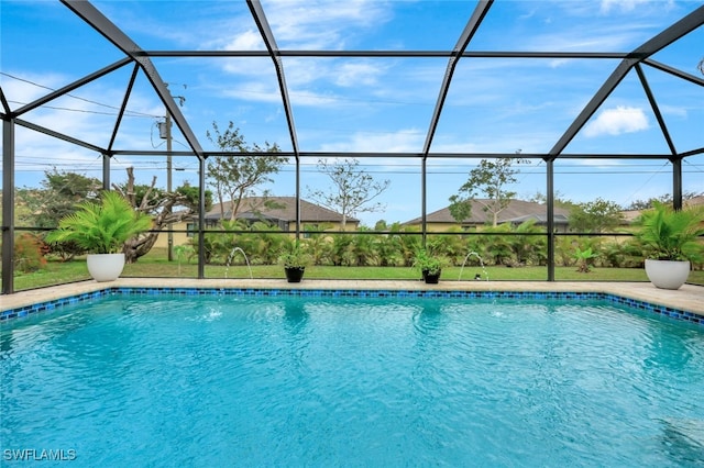 view of pool featuring pool water feature and a lanai