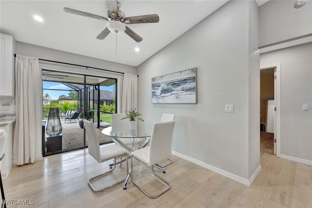 dining area with lofted ceiling, ceiling fan, and light hardwood / wood-style floors