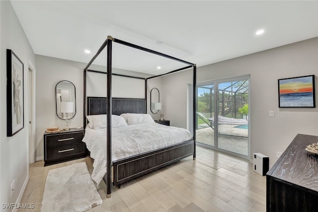 bedroom with light wood-type flooring and access to outside