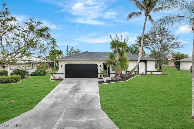 ranch-style house featuring a garage and a front lawn