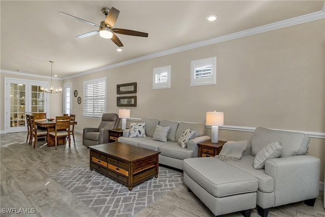 living room featuring ceiling fan, french doors, and ornamental molding