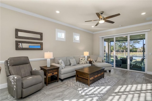 living room with ceiling fan and crown molding