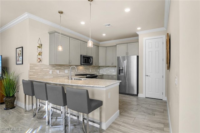 kitchen with kitchen peninsula, gray cabinets, sink, and stainless steel appliances